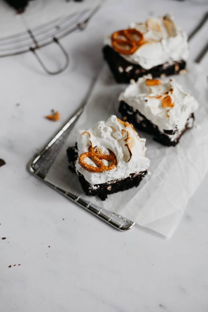 Three campfire brownies with pretzels on top