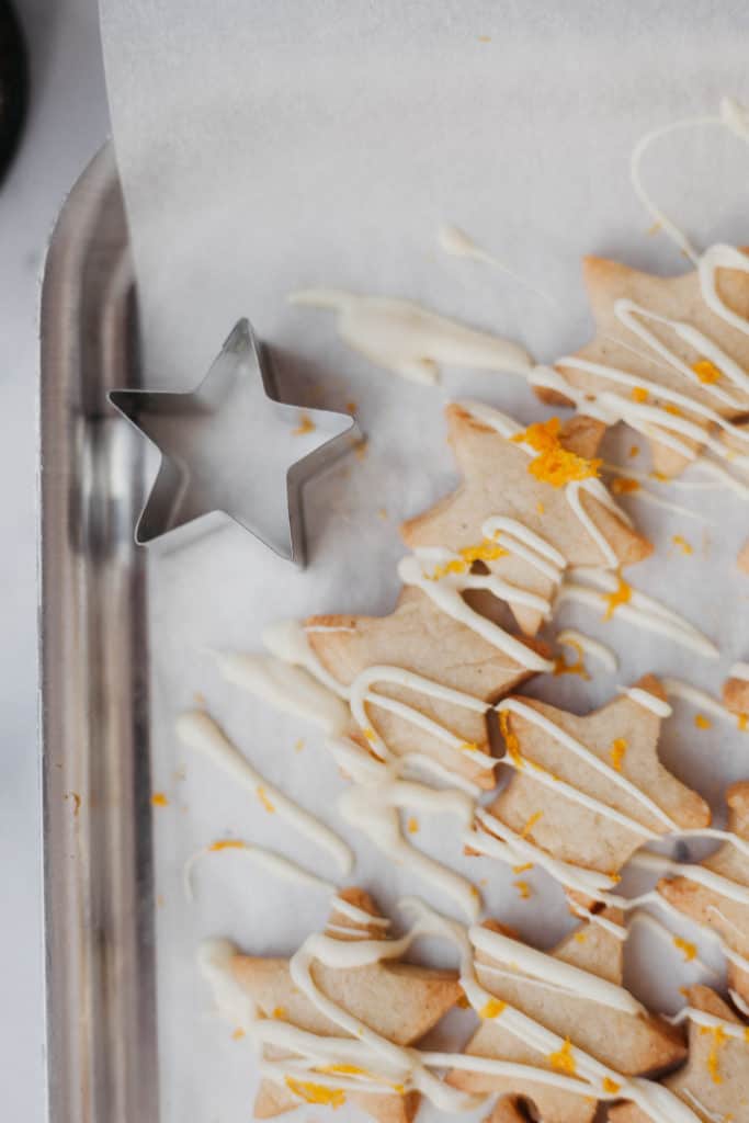 shortbread cookies on a tray with a star cookie cutter