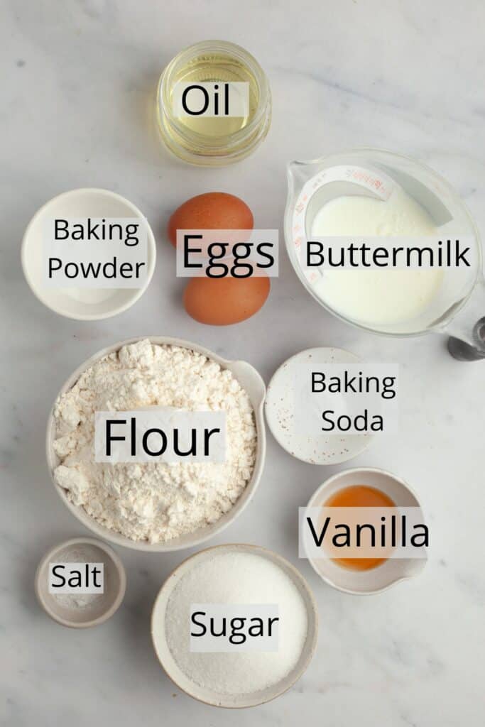 All the ingredients needed to make cinnamon swirl muffins, weighed out into small bowls.