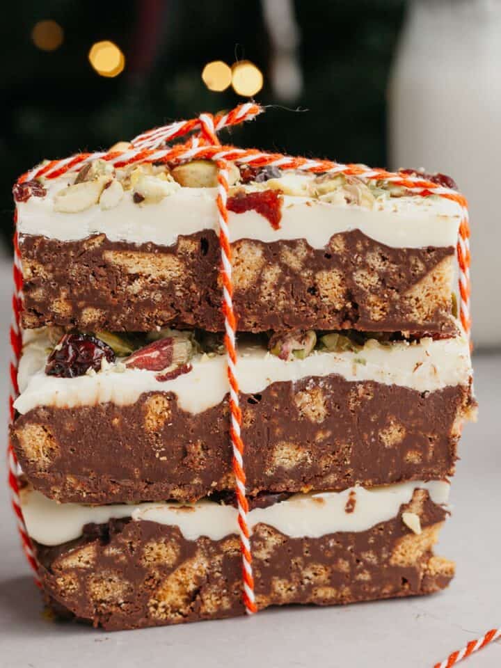 a stack of 3 chocolate tiffin bars, tied up with red and white string.