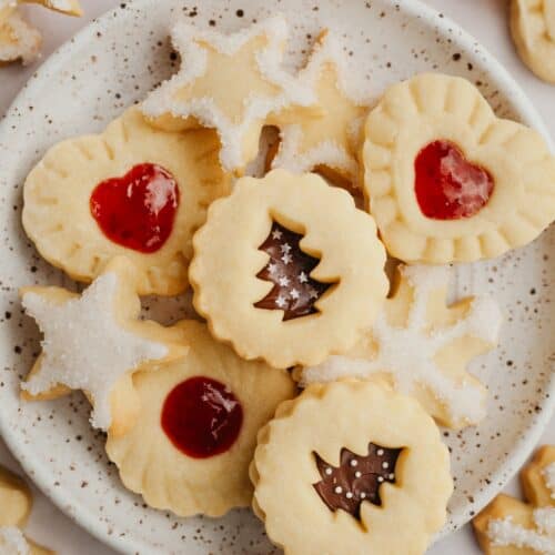 A small plate with shortbread cookies in different shapes.