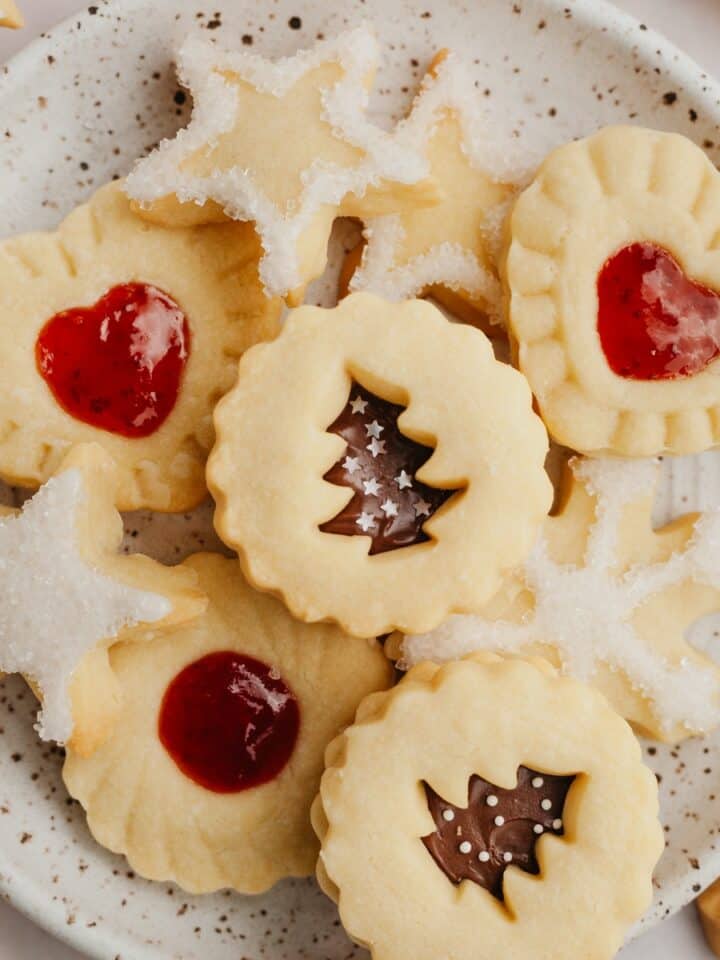 A small plate with shortbread cookies in different shapes.
