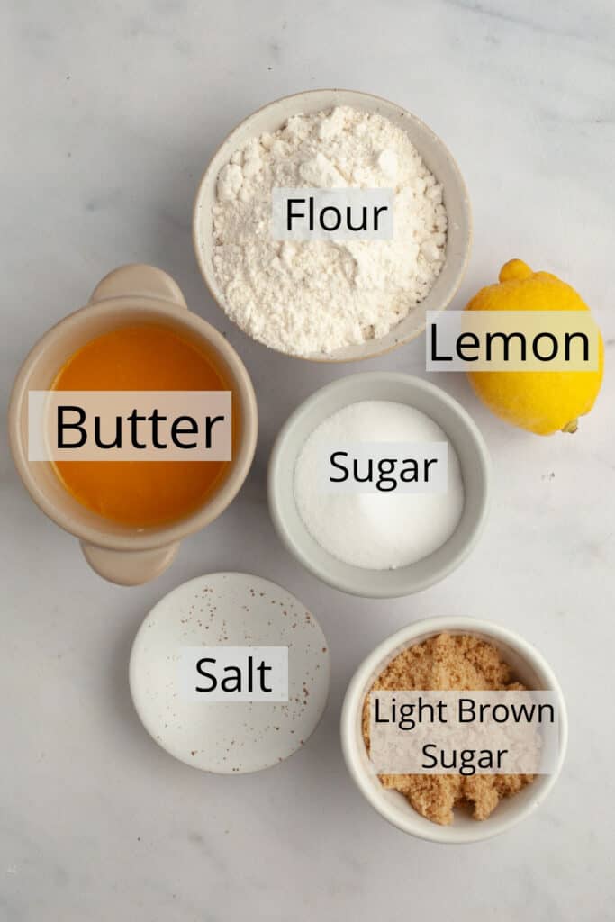 All the ingredients needed to make a lemon crumb topping, weighed out into small bowls.