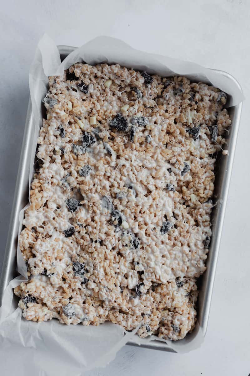 A 9x13 inch baking pan filled with rice krispie treat batter