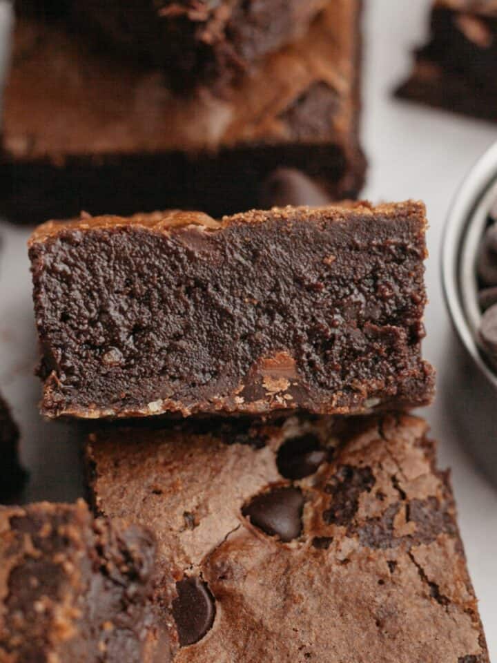 A fudgy brownie on parchment paper.