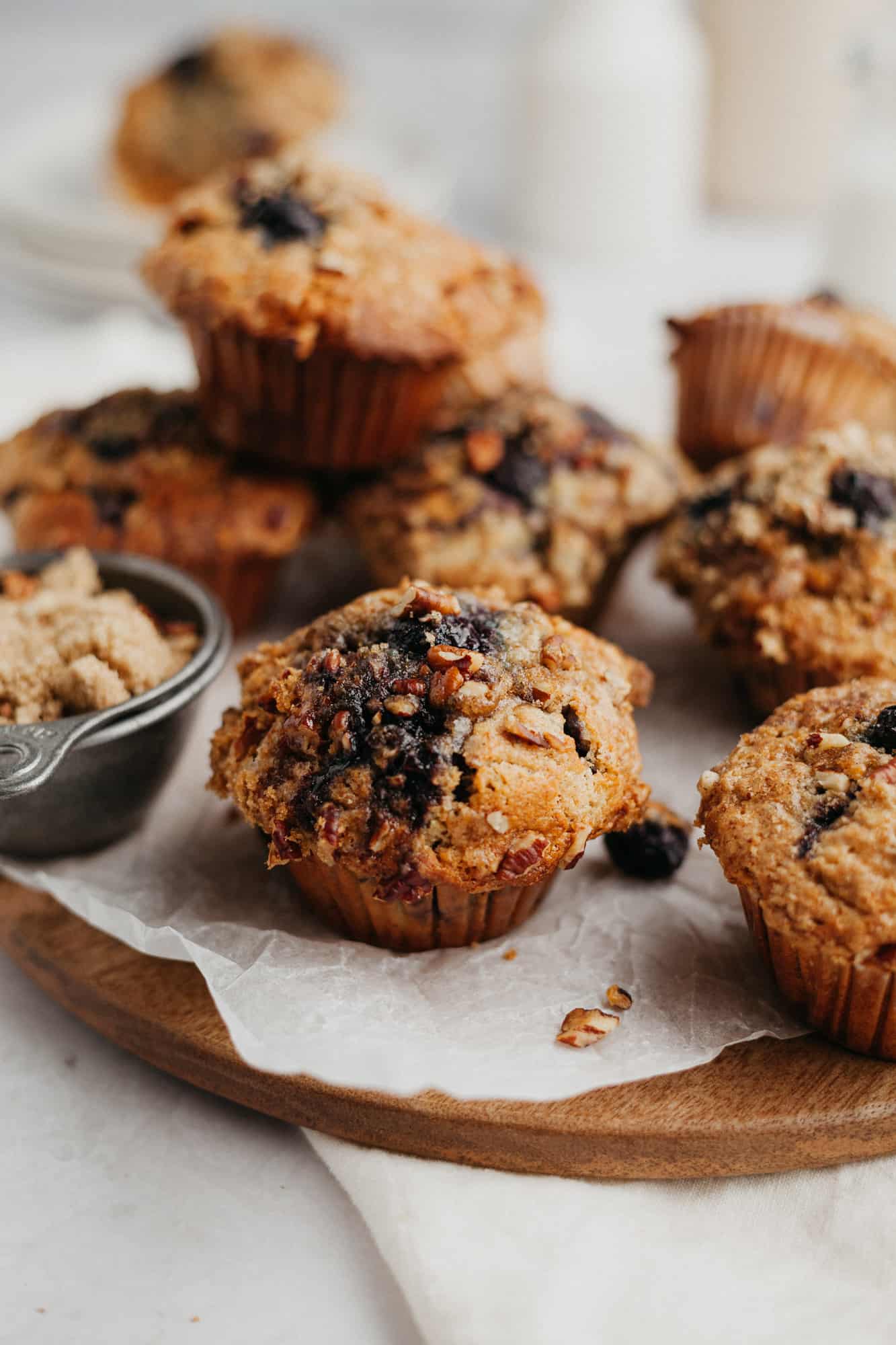 Banana blueberry oatmeal muffins on parchment paper