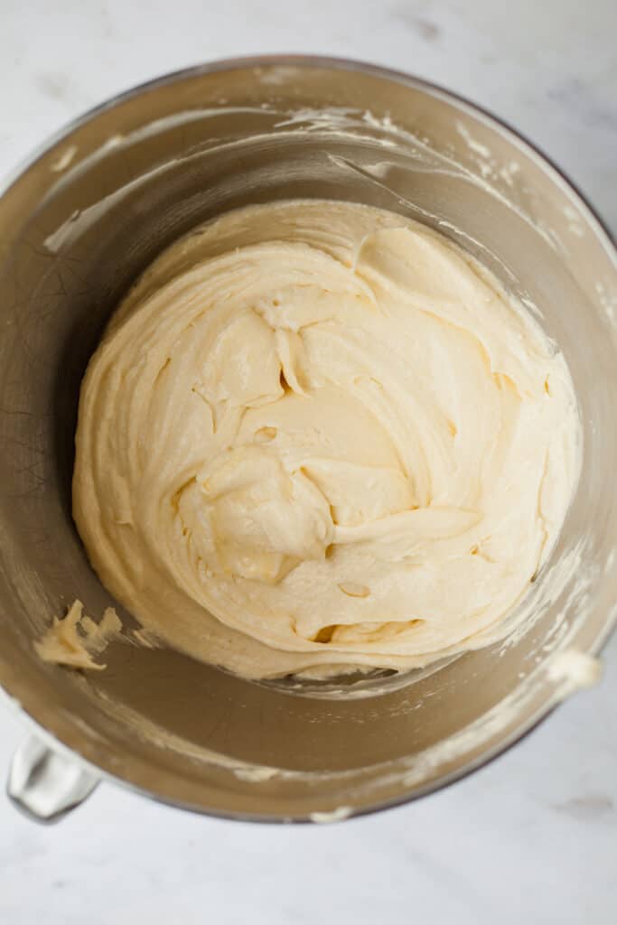 Pound cake batter in a silver mixing bowl
