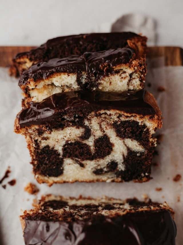 Three slices of a marble loaf with a chocolate ganache on top