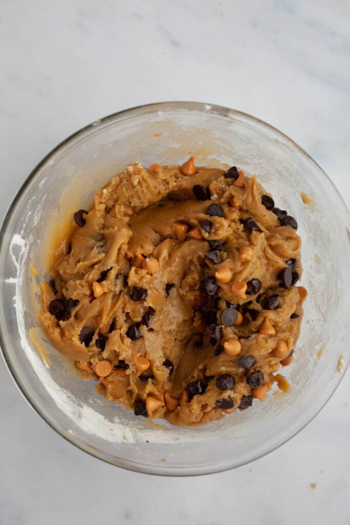 chocolate chip butterscotch cookie dough in a pyrex bowl