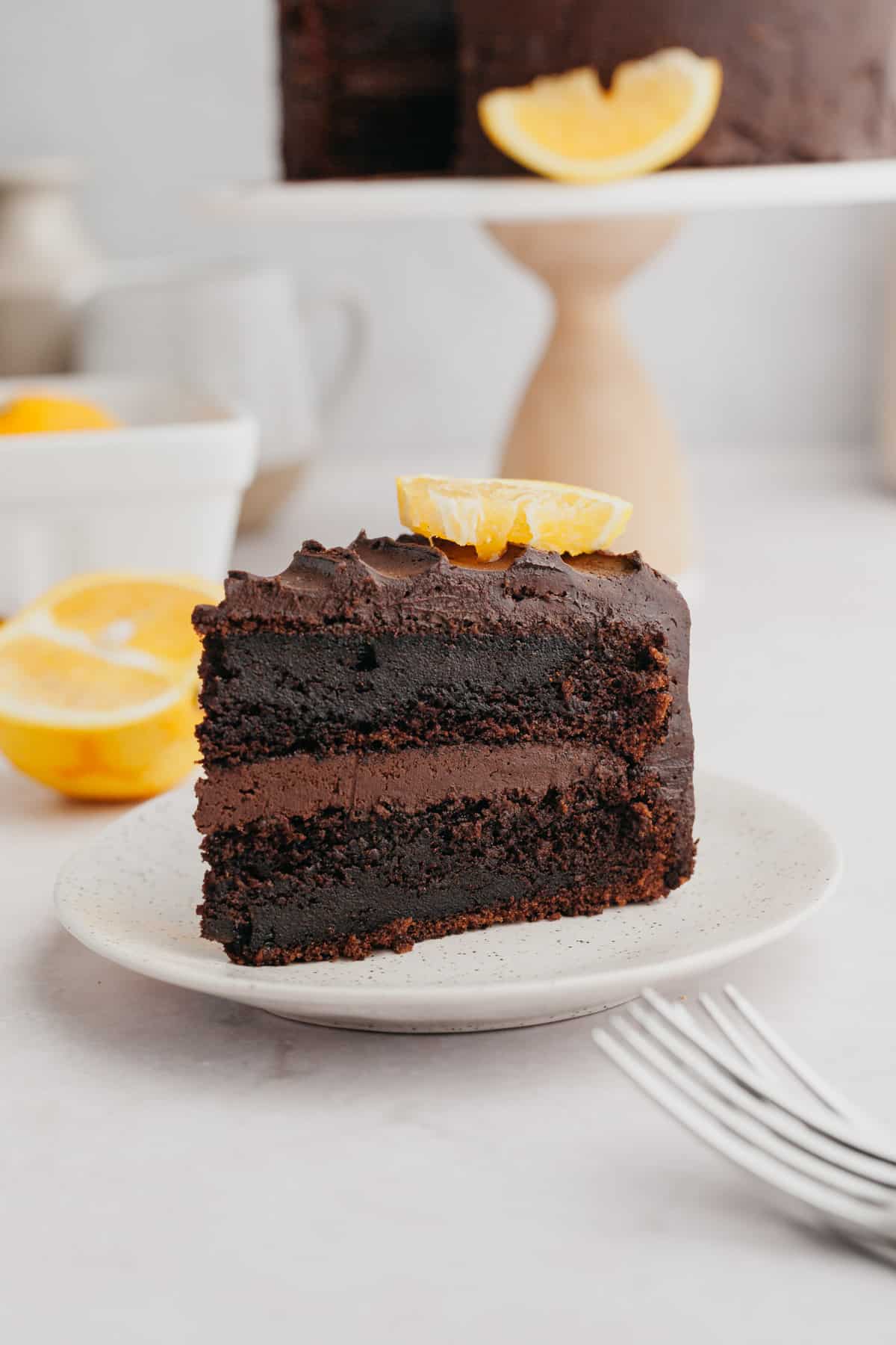 A slice of chocolate cake on a small plate.