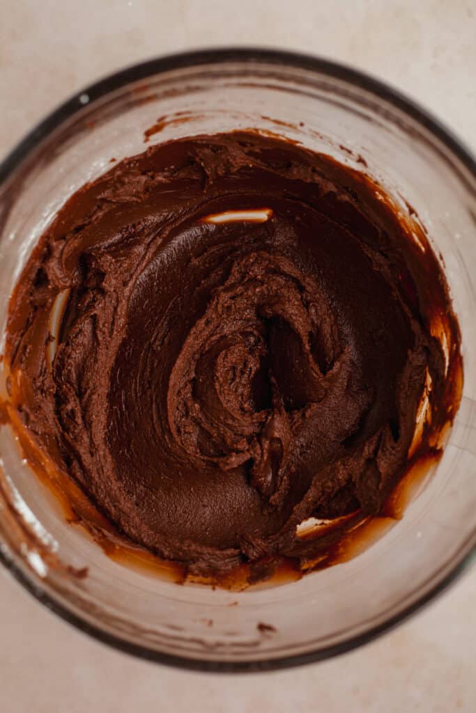 chocolate orange frosting in a glass bowl