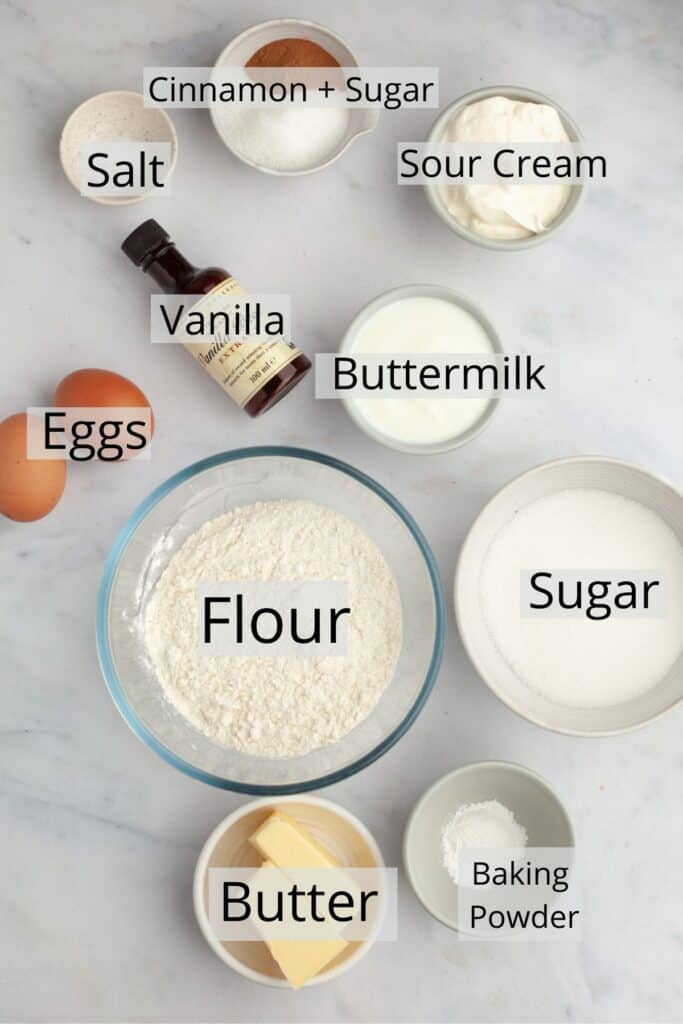 All the ingredients needed to make cinnamon cupcakes weighed out into small bowls.