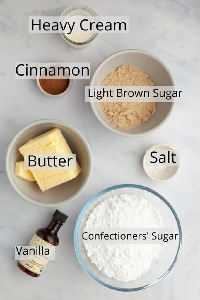 All the ingredients needed to make cinnamon buttercream weighed out into small bowls.