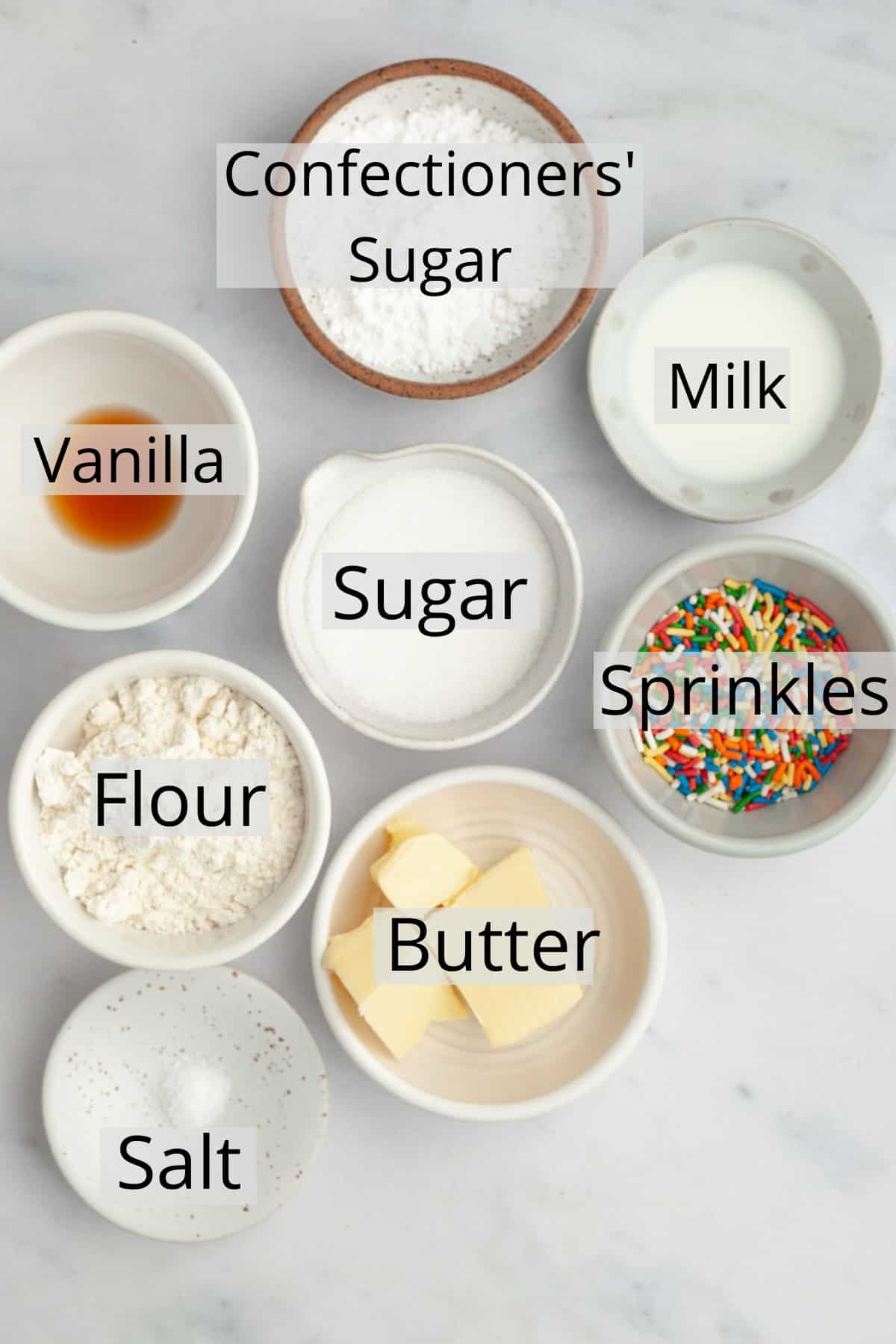 All the ingredients needed to make edible sugar cookie dough, weighed out into small bowls.