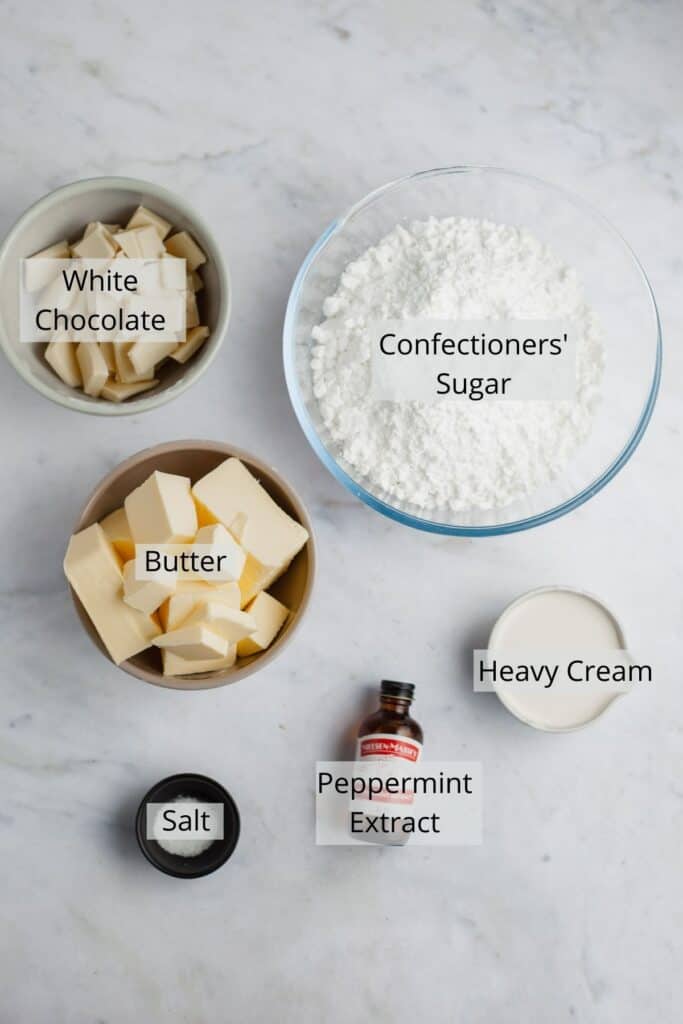 All the ingredients for peppermint buttercream weighed out in small bowls.