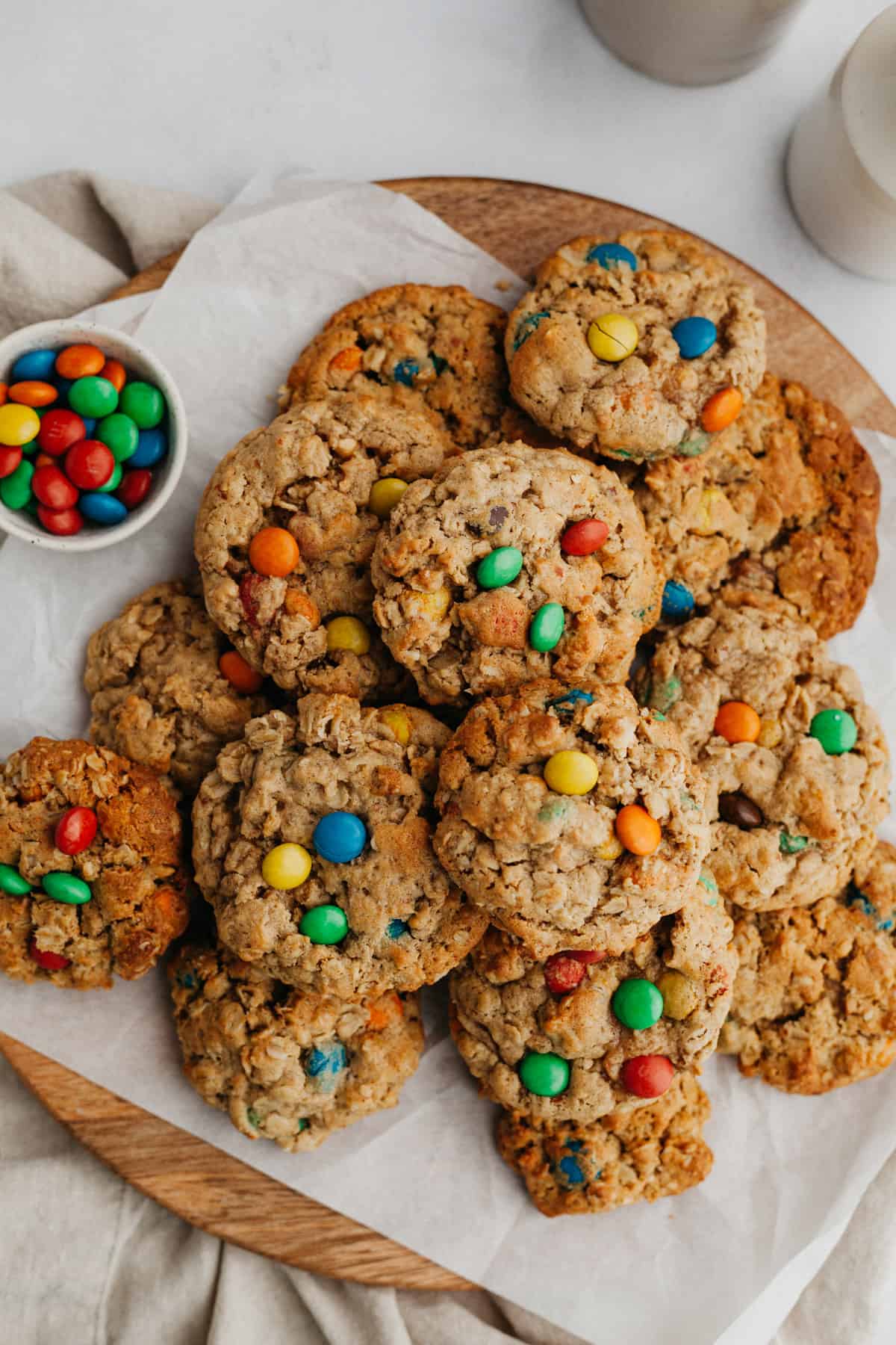 Oatmeal M&M cookies on parchment paper.