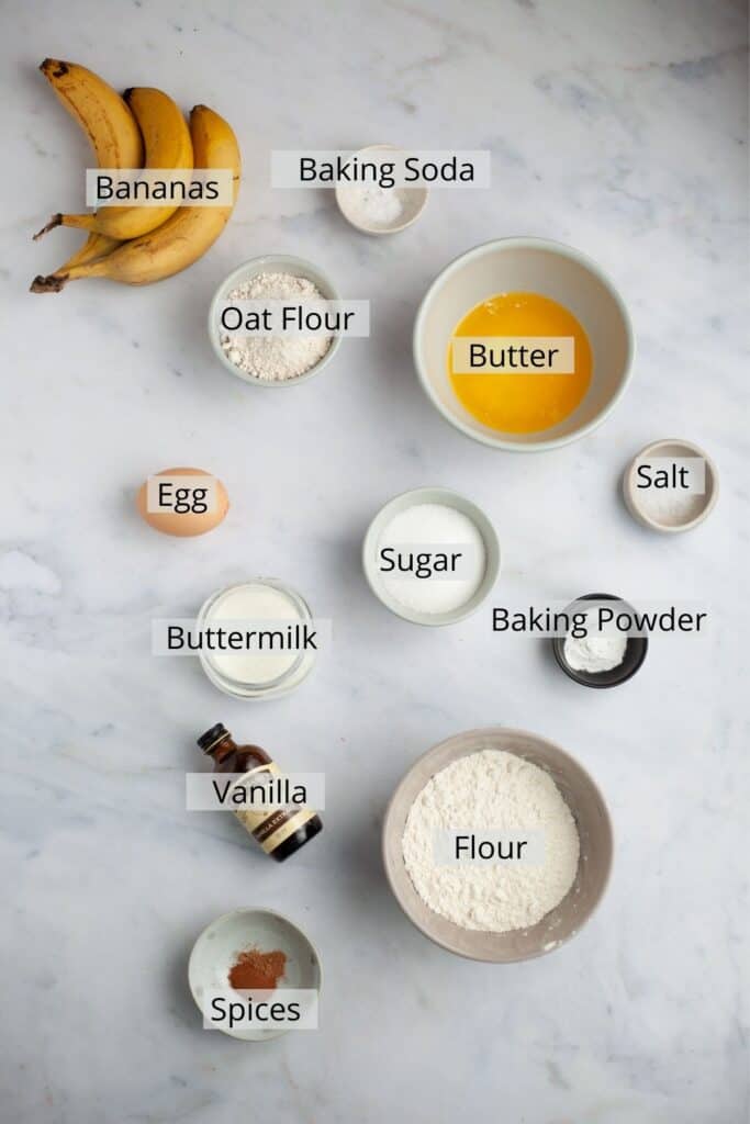 all the ingredients for banana muffins weighed out in small bowls.