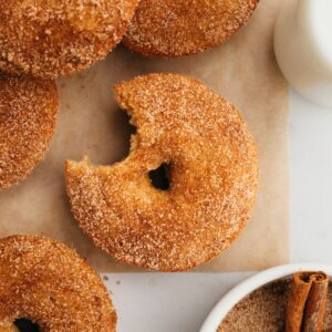 A close up of baked cinnamon sugar donuts.