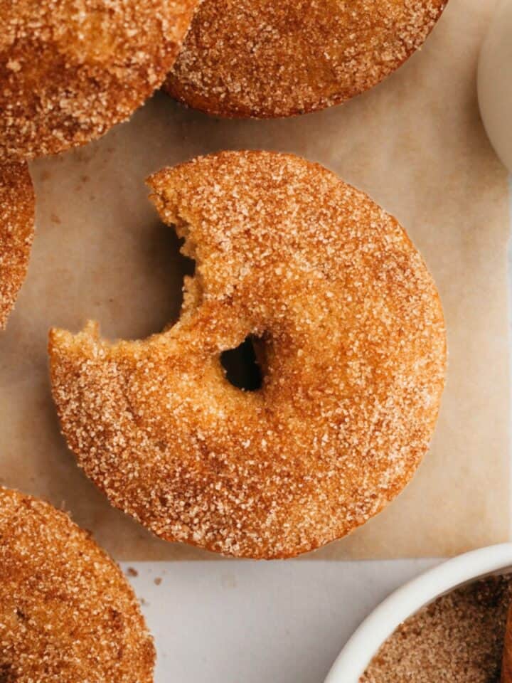 A close up of baked cinnamon sugar donuts.
