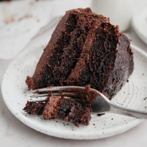 a slice of chocolate cake on a small plate.