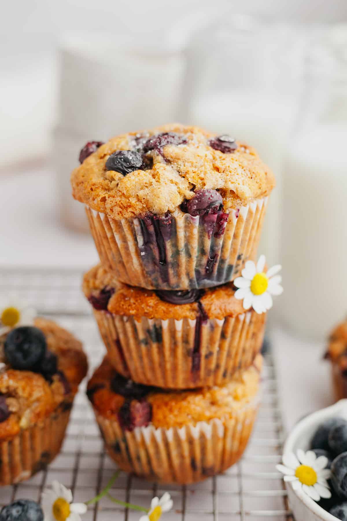 A stack of three blueberry muffins.
