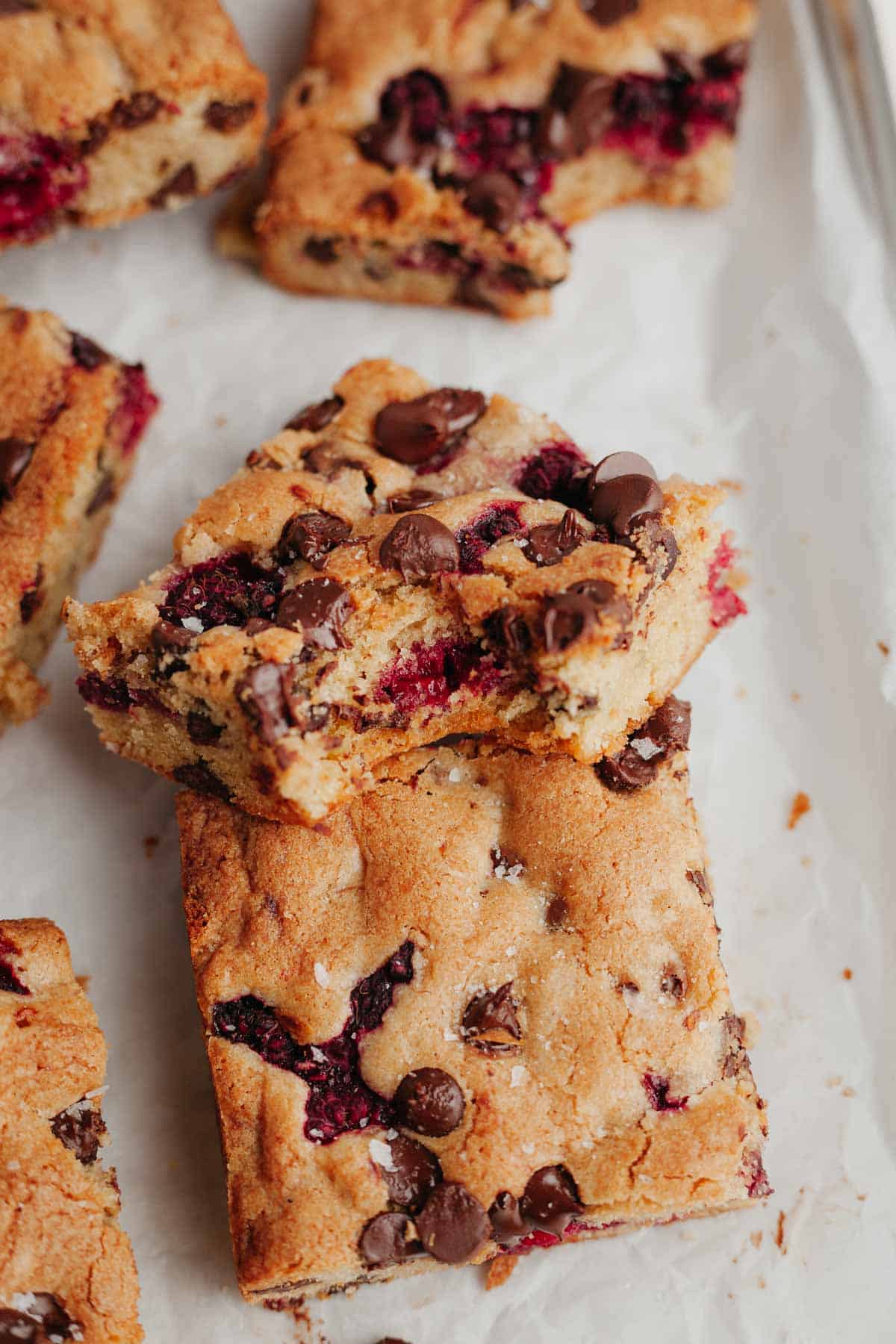 A raspberry blondie with a bite taken out of it.