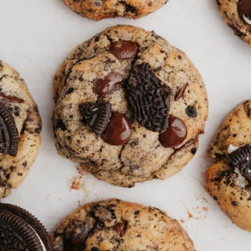Oreo chocolate chip cookies on parchment paper.