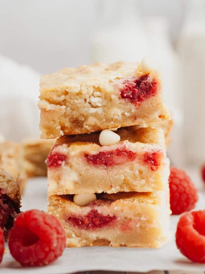 A stack of raspberry white chocolate blondies.