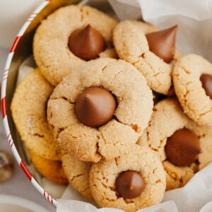 Peanut butter thumbprint cookies in a tin.