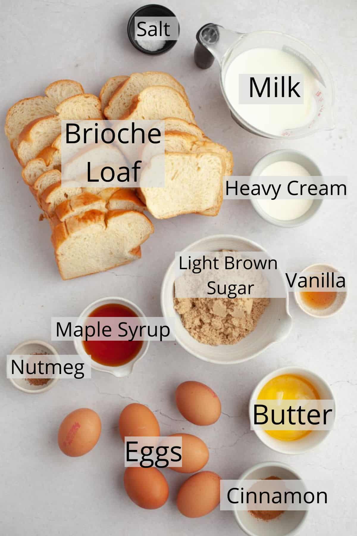 All the ingredients needed to make brioche french toast casserole, weighed out into small bowls.