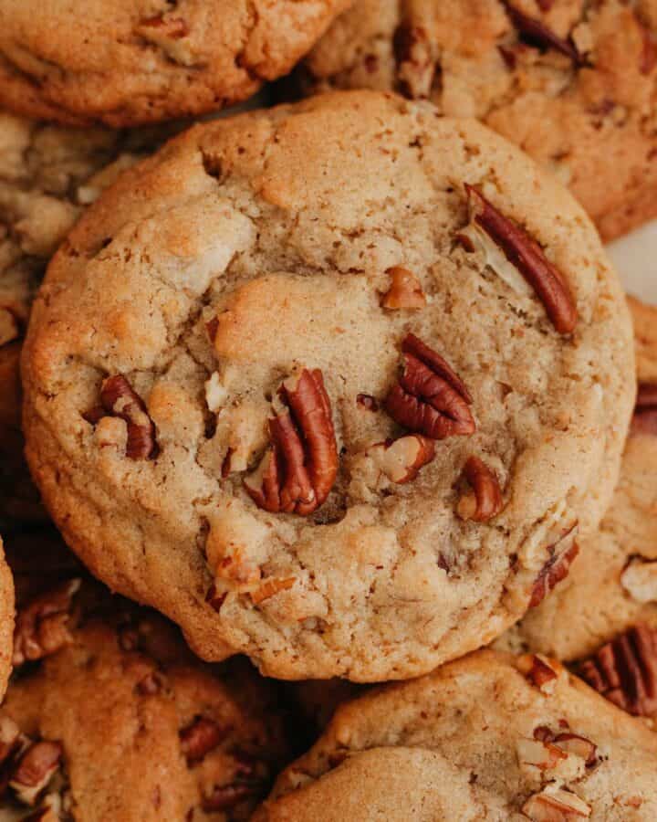 A pile of browned butter pecan cookies.