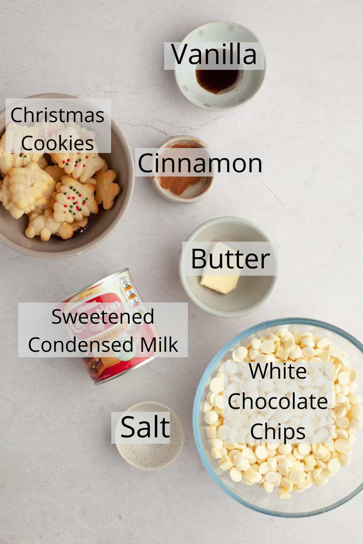 All the ingredients needed to make Christmas cookie fudge weighed out into small bowls.