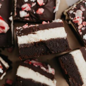 Peppermint layered brownies on parchment paper.