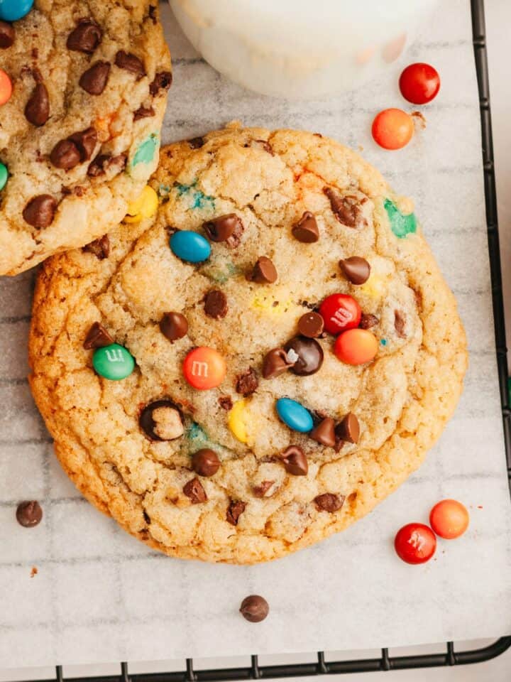 M&M chocolate chip cookies on parchment paper.