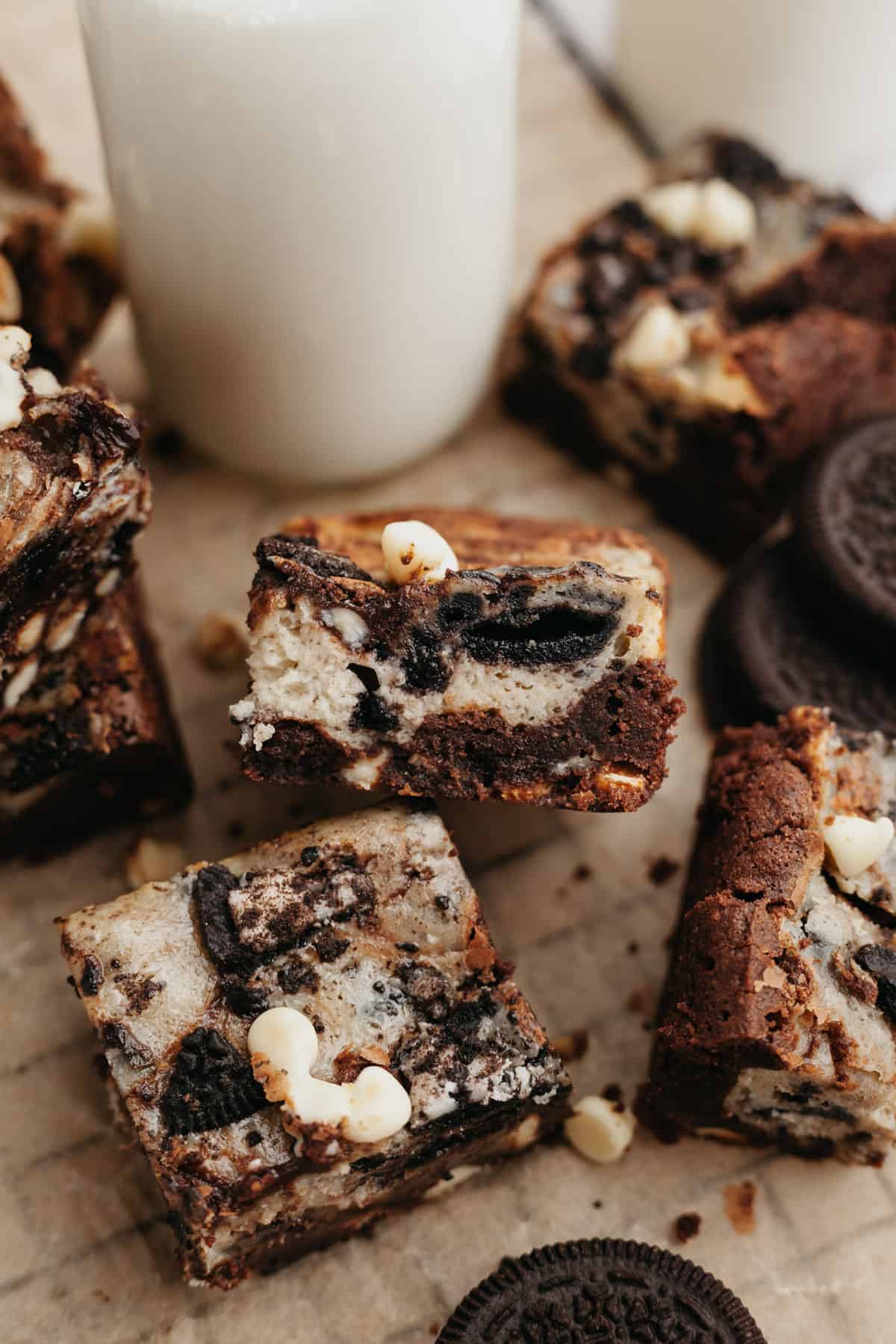 Oreo cream cheese brownies on parchment paper.