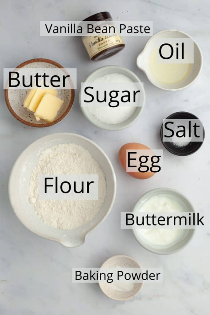 All the ingredients needed to make small batch vanilla cupcakes, weighed out into small bowls.