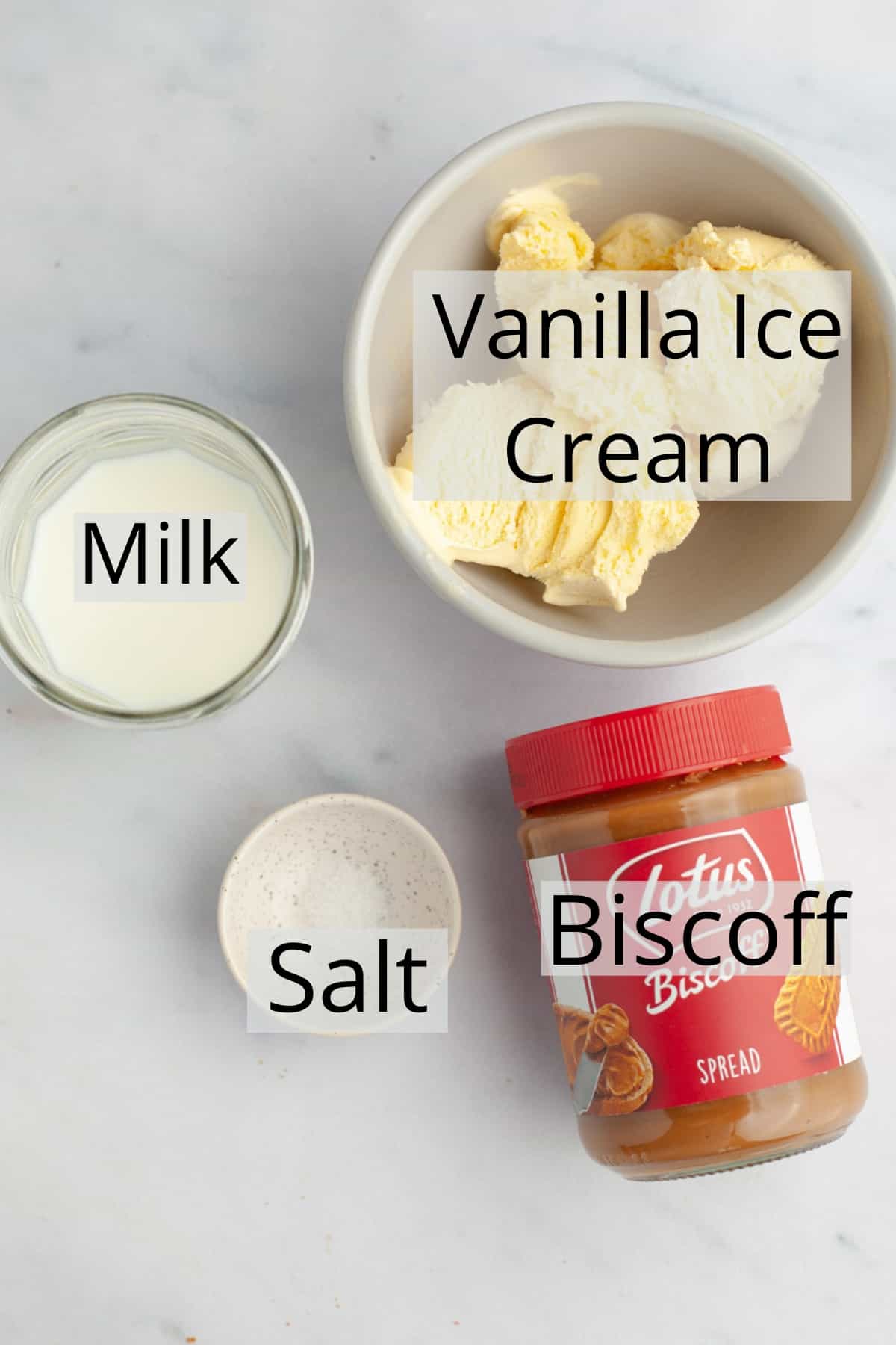 all the ingredients needed to make a biscoff milkshake weighed out into small bowls.