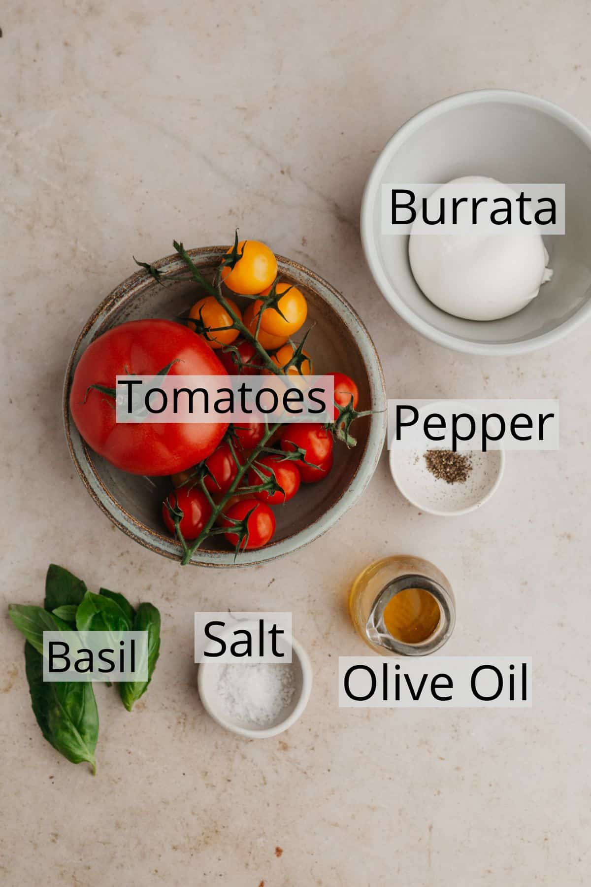 All the ingredients needed to make burrata caprese salad.