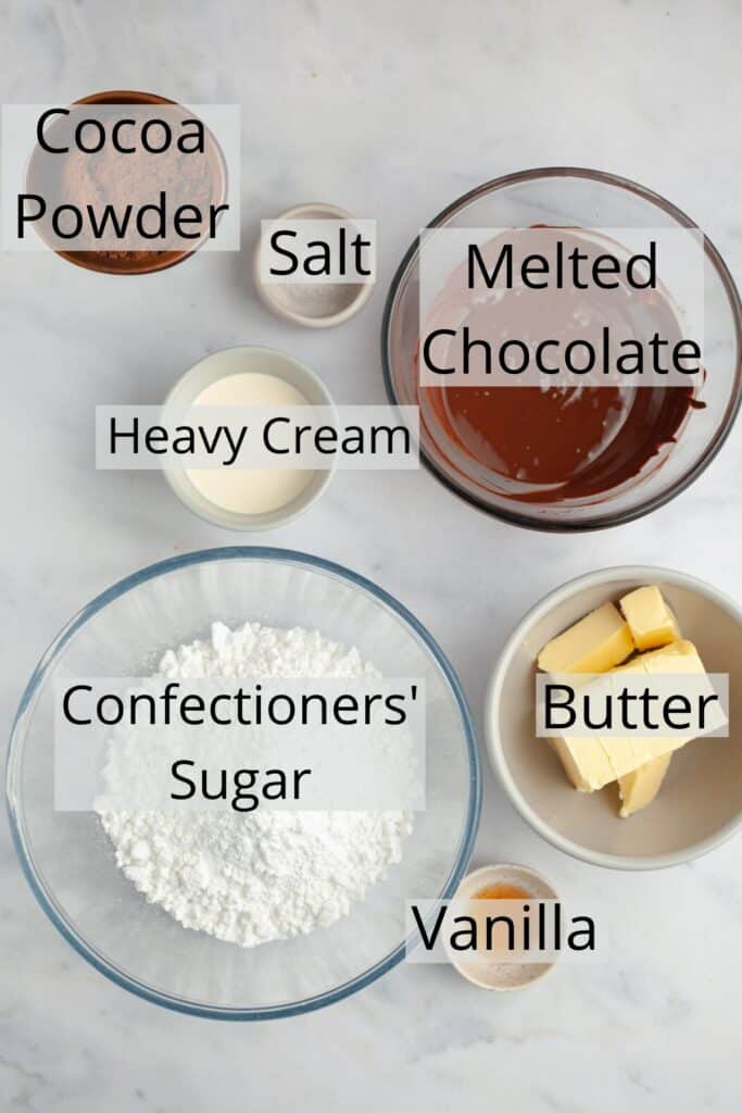 All the ingredients needed to make chocolate frosting weighed out into small bowls.