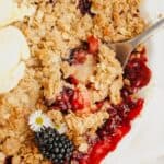 A close up of a blackberry apple crumble.