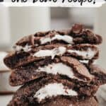 A stack of chocolate marshmallow cookies on parchment paper.