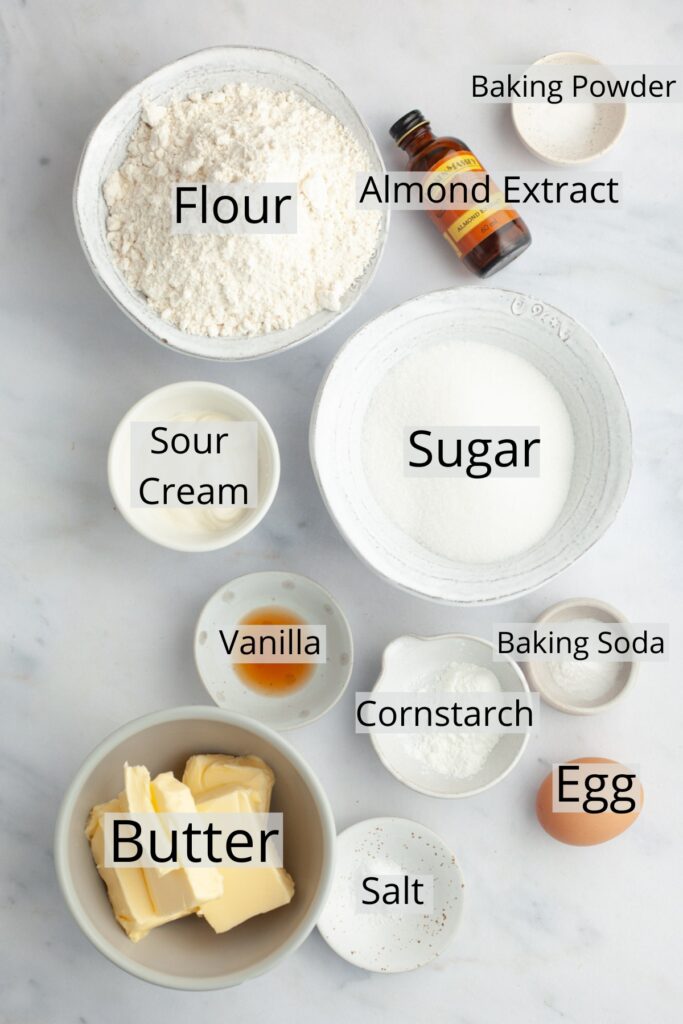 All the ingredients needed to make soft sugar cookies, weighed out into small bowls.