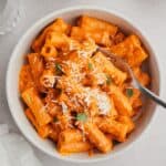 Spicy vodka pasta in a small white bowl.