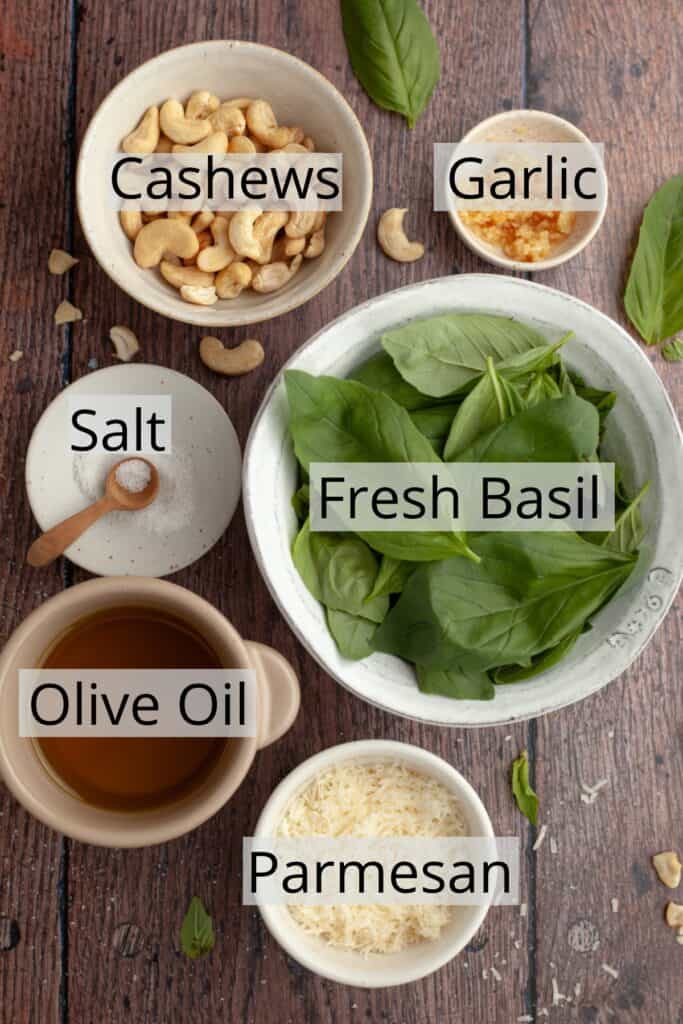 All the ingredients needed to make cashew pesto weighed out into small bowls.
