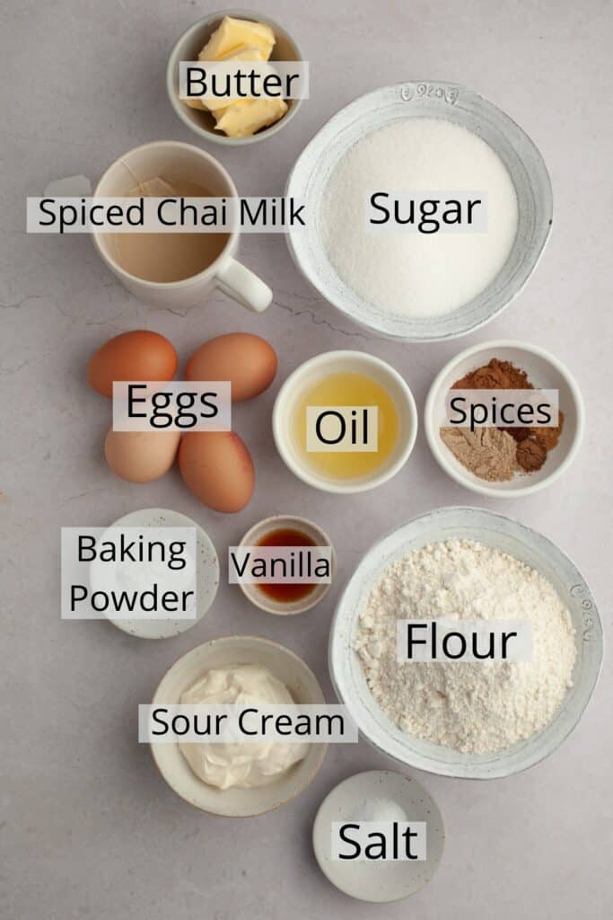 All the ingredients needed to make a chai cake, weighed out into small bowls.