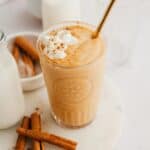 A pumpkin smoothie in a large glass.