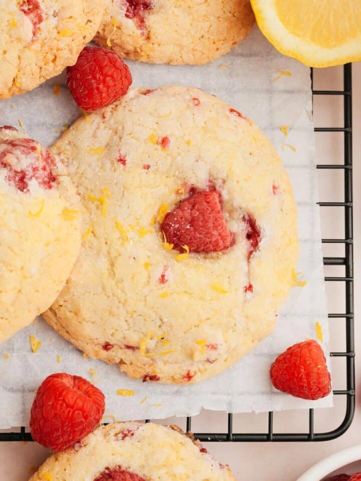 Lemon raspberry cookies on parchment paper.