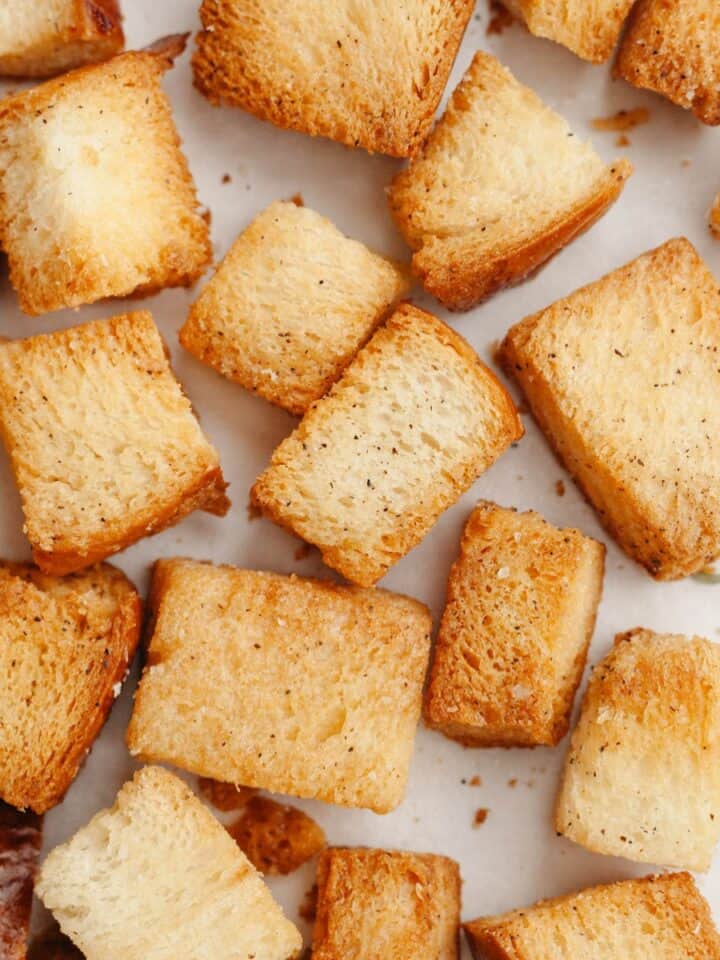 Brioche croutons on a baking sheet.