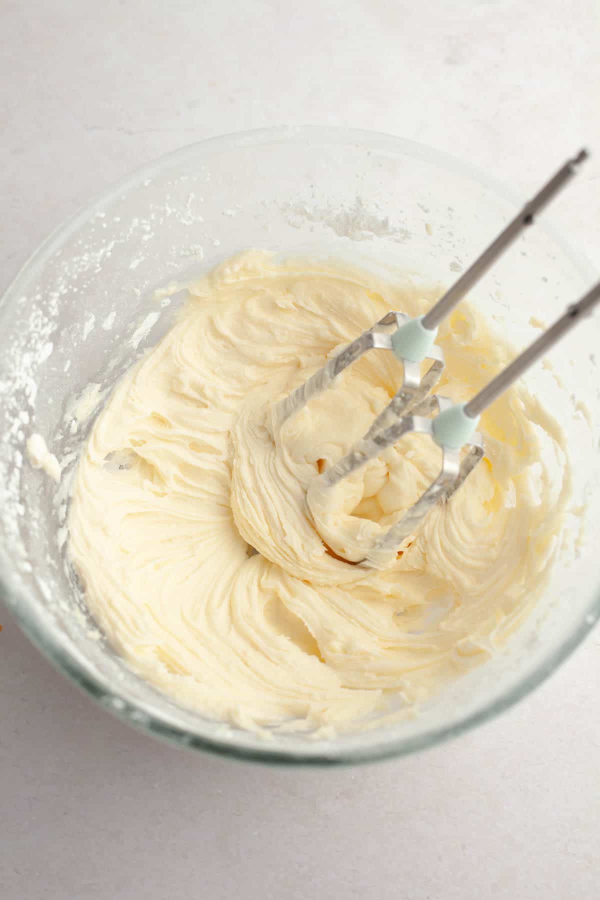 Cream cheese frosting in a bowl.