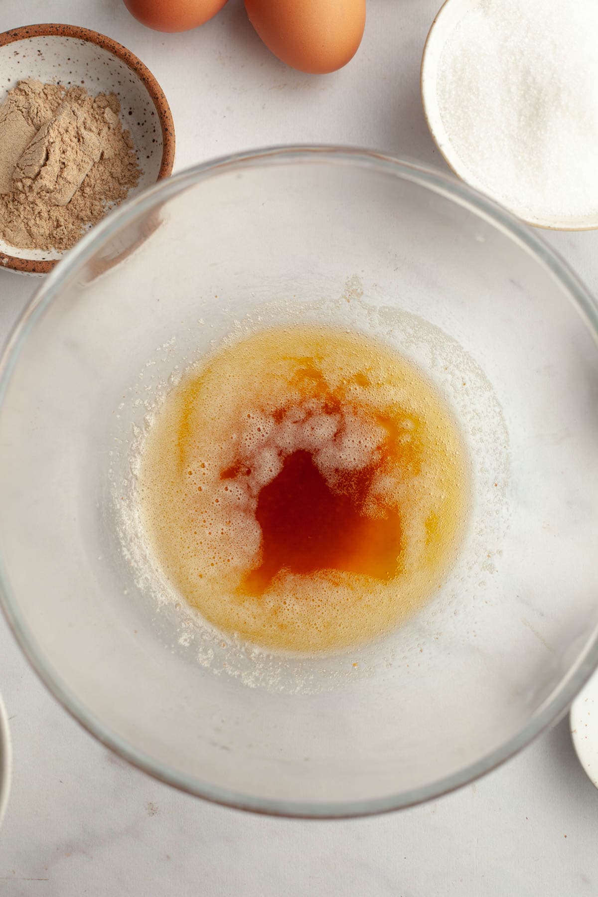 A large glass bowl with browned butter in it.